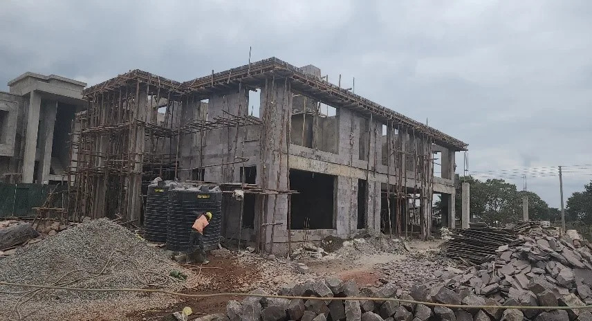 Engineers inspecting and monitoring construction progress at a building site in Kenya
